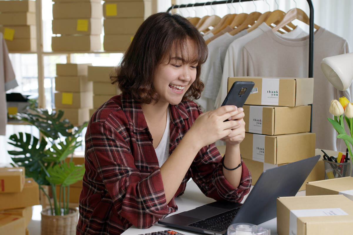 A happy woman on her phone